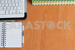 Stack of hardback books on wooden table. Back to school. Copy space. Top view