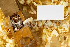 Carpenter tools on wooden table with sawdust. Circular Saw.