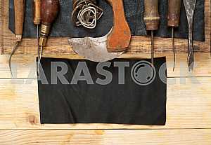 Carpenter tools on wooden table with sawdust. Circular Saw.