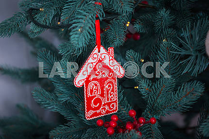 Pine-tree decoration stylish, red little house close-up