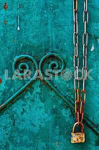 Background with a rusty chain with a lock