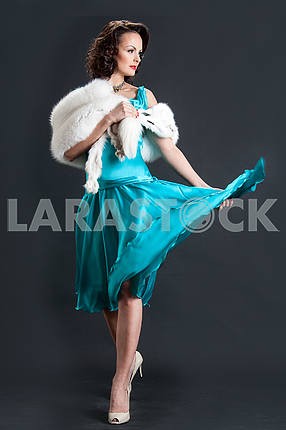 studio picture of beautiful woman with white fur
