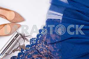 Woman clothes and accessories. Soft blue colors female apparel.