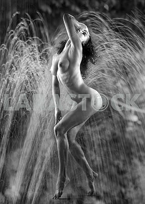 Nude model in a dynamic pose