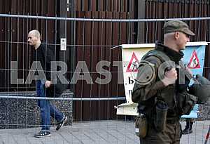 Man (left) leaves the Russian embassy after the vote
