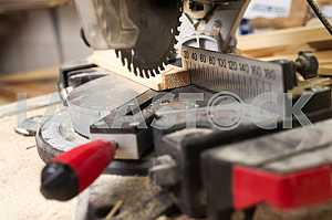 Different construction tools on a wooden background - screwdriver, caliper.