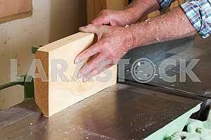 Carpenter tools on wooden table with sawdust. Circular Saw. Carpenter workplace top view