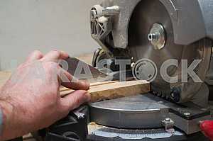 Carpenter tools on wooden table with sawdust. Circular Saw.