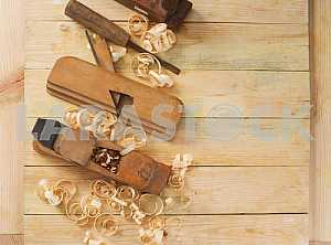 Carpenter tools on wooden table with sawdust. Circular Saw.