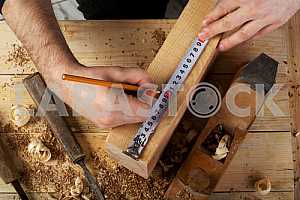 Carpenter tools on wooden table with sawdust. Circular Saw.