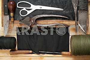 Carpenter tools on wooden table with sawdust. Circular Saw.