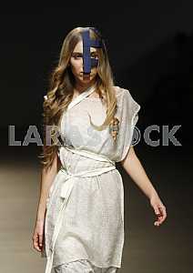 The model during demonstrates outfit by Ukrainian designer DIA
