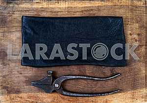 Different construction tools on a wooden background - screwdriver, caliper.