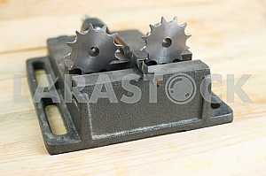Different construction tools on a wooden background - screwdriver, caliper.