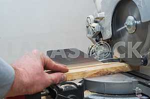 Carpenter tools on wooden table with sawdust. Circular Saw.