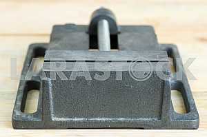 Different construction tools on a wooden background - screwdriver, caliper.