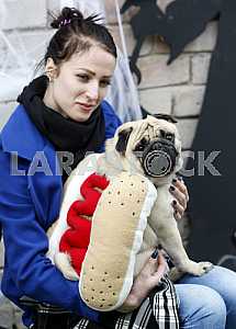 Girl with dog in a suit hotdog