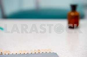 Stomatological instrument in the dentists clinic. Operation, tooth replacement.