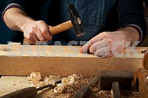 Carpenter tools on wooden table with sawdust. Circular Saw.
