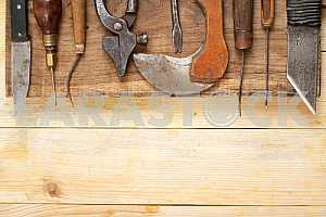 Carpenter tools on wooden table with sawdust. Circular Saw.