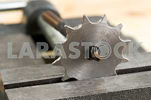 Different construction tools on a wooden background - screwdriver, caliper.