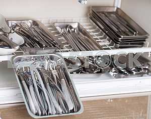Stomatological instrument in the dentists clinic. Operation, tooth replacement.
