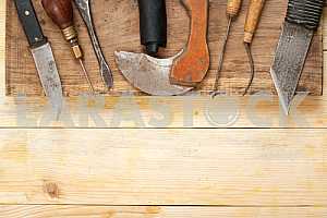 Carpenter tools on wooden table with sawdust. Circular Saw.