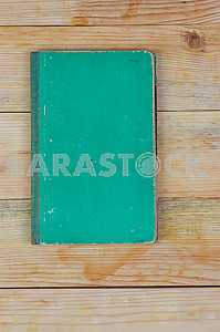 Open book, stack of hardback books on wooden table. Back to school. Copy space