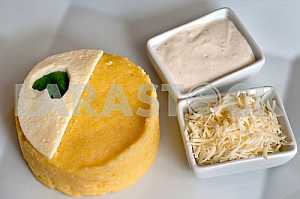 Banush - traditional ukrainian corn dish with cottage cheese and sour cream.