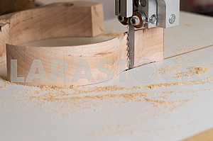 Carpenter tools on wooden table with sawdust. Circular Saw. Carpenter workplace top view