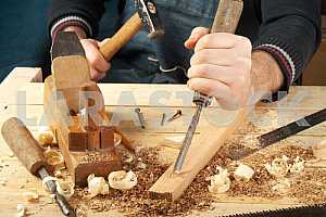 Carpenter tools on wooden table with sawdust. Circular Saw.