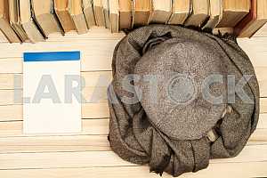 Stack of hardback books on wooden table. Back to school. Copy space. Top view