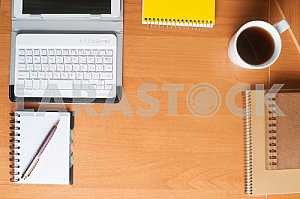 Stack of hardback books on wooden table. Back to school. Copy space. Top view