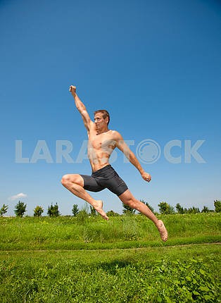 young athletic man jumps