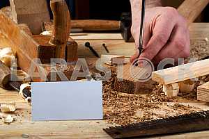 Carpenter tools on wooden table with sawdust. Circular Saw.