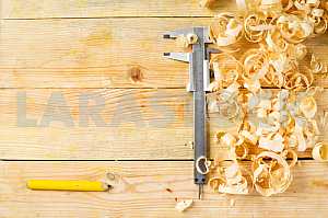 Carpenter tools on wooden table with sawdust. Circular Saw.