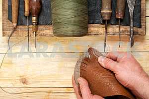 Carpenter tools on wooden table with sawdust. Circular Saw.