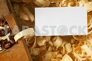 Carpenter tools on wooden table with sawdust. Circular Saw.
