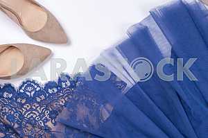 Woman clothes and accessories. Soft blue colors female apparel.