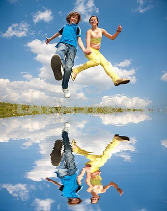 Girl and boy jumping. Soft focus. Focus on eyes.