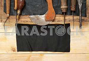 Carpenter tools on wooden table with sawdust. Circular Saw.