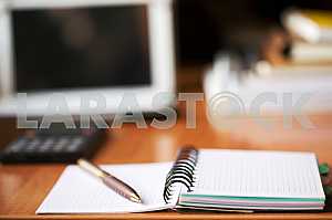 Stack of hardback books on wooden table. Back to school. Copy space. Top view