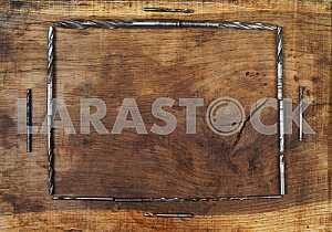 Different construction tools on a wooden background - screwdriver, caliper.