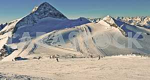 Mountain top casts a shadow.