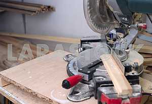 Different construction tools on a wooden background - screwdriver, caliper.