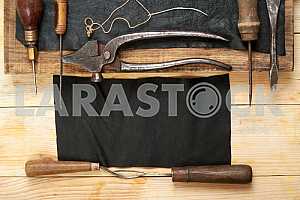 Carpenter tools on wooden table with sawdust. Circular Saw.