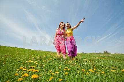 funny mother and daughter on green grass