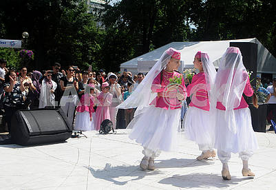 Girls in Crimean Tatar costumes dance