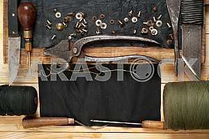 Carpenter tools on wooden table with sawdust. Circular Saw.