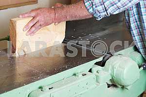 Carpenter tools on wooden table with sawdust. Circular Saw. Carpenter workplace top view